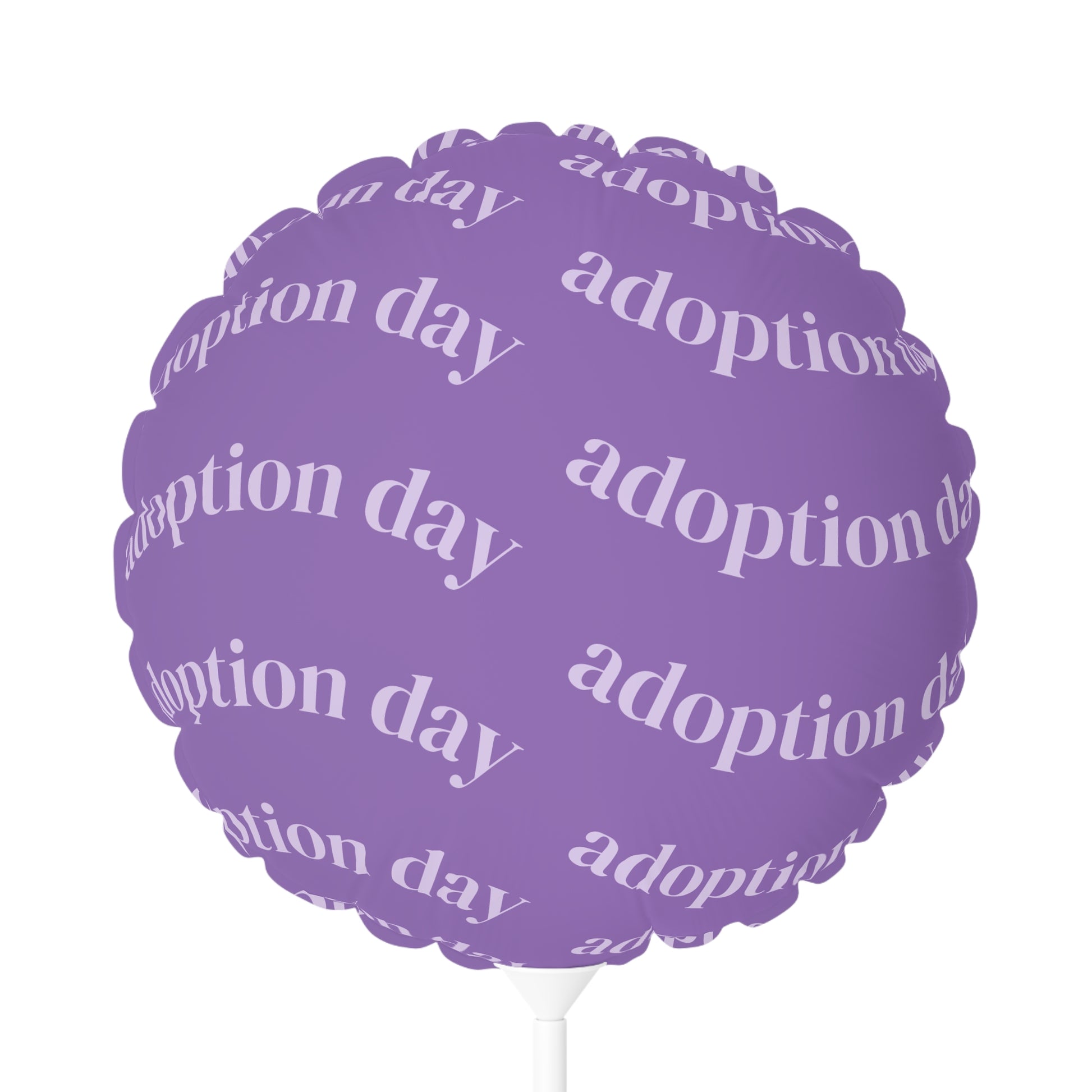 Purple balloon with 'adoption day' text on a white background