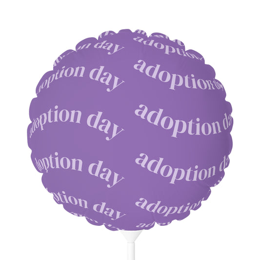 Purple balloon with 'adoption day' text on a white background